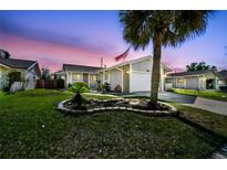 Charming single-story home with well-manicured lawn and landscape beds at 387 Kantor Blvd, Casselberry, FL 32707