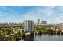 A high-rise condo offers stunning city views and a serene lake at 400 E Colonial Dr # 1003, Orlando, FL 32803