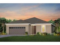 Charming single-story home with neutral stucco, brown accents, and attached two car garage at 2741 Serenity Meadow Dr, Kissimmee, FL 34744