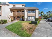 Inviting townhome featuring a balcony, green lawn, and convenient parking at 440 Orienta Point St, Altamonte Springs, FL 32701