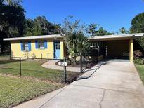 Charming single story home featuring a well-maintained front yard and a convenient carport at 951 Cr 453, Lake Panasoffkee, FL 33538