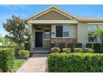 Charming single-story home featuring a well-maintained lawn and lovely landscaping at 10006 Quail Meadow Aly, Winter Garden, FL 34787