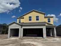 New two story home featuring a spacious layout and attached two-car garage at 1157 Basalt Ln, Sanford, FL 32771
