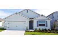 Charming single-story home with a two car garage, landscaped front yard, and a welcoming entrance at 33455 Copper Hill Way, Sorrento, FL 32776