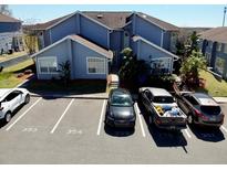 Charming two-story condominium with well-maintained landscaping and convenient parking at 658 Caribbean Dr, Davenport, FL 33897