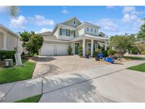 Charming two-story home with a beautifully landscaped yard and a three-car garage at 8778 Peachtree Park Ct, Windermere, FL 34786