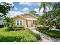 Charming home with landscaped yard, stone walkway, and front porch at 1333 W Yale St, Orlando, FL 32804