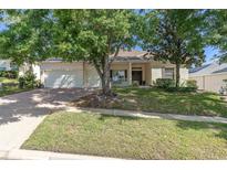 Charming single-story home with a well-maintained lawn and mature shade trees at 2780 Highland View Cir, Clermont, FL 34711