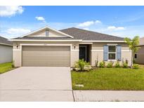 Charming single-story home featuring a two-car garage and well-maintained landscaping at 3823 Pronghorn Dr, St Cloud, FL 34772