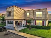 Charming condo with unique architectural features and manicured landscaping, plus a parking space at 200 Saint Andrews Blvd # 2306, Winter Park, FL 32792
