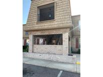 Two story condo with a brick facade and ornamental iron work at 200 Saint Andrews Blvd # 2306, Winter Park, FL 32792