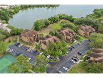 Condo complex featuring multiple buildings, ample parking, and mature landscaping offering serene living at 390 Lake Placid Ct # 304, Altamonte Springs, FL 32701
