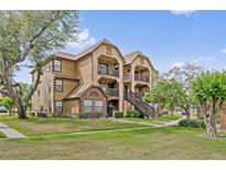 Charming apartment building with balconies, landscaped lawn, and sidewalk access, perfect for comfortable living at 390 Lake Placid Ct # 304, Altamonte Springs, FL 32701