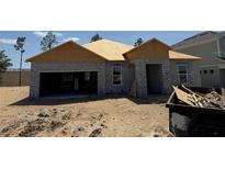 Image of the construction of the exterior of a one-story home with a garage at 756 Pointe Emerson Blvd, Apopka, FL 32703