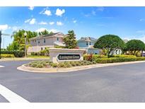 Lexington Green community sign featuring lush landscaping and views of neighborhood homes under a bright blue sky at 1204 Lexington Ave, Davenport, FL 33837