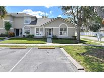 Charming single-story home with well-manicured lawn and convenient parking at 2112 Cypress Bay Blvd, Kissimmee, FL 34743