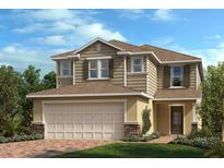 Charming two-story home features a brick-accented facade, a two-car garage, and a manicured lawn at 3389 Rolling Plains Cir, Clermont, FL 34714
