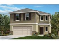 Charming two-story home with a two-car garage and beautifully landscaped front yard at 8328 Caribbean Pine Way, Lakeland, FL 33809