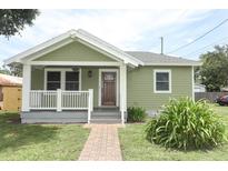 Charming single-story home with a welcoming front porch and well-maintained lawn at 1312 7Th St, St Cloud, FL 34769