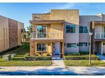 Modern two-story home with a stone accent wall and balcony at 7672 Amazonas St, Kissimmee, FL 34747