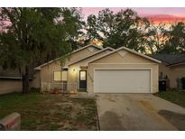 Charming single-Gathering home with a well-maintained lawn, and inviting front porch at 1105 Mill Run Cir, Apopka, FL 32703