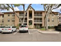 Multi-story building with balconies and well-maintained landscaping at 956 Salt Pond Pl # 207, Altamonte Springs, FL 32714