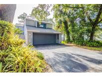 Charming home featuring an attached two-car garage, well-kept lawn, and a welcoming driveway at 121 Primrose Dr, Longwood, FL 32779