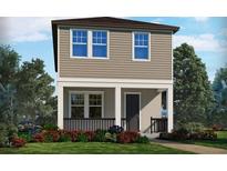 Charming two-story home with a welcoming front porch and beautifully landscaped front yard at 11957 Bracco St, Winter Garden, FL 34787