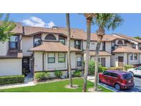 Charming townhome featuring well-manicured landscaping and a private entrance at 3106 S Semoran Blvd # P-2, Orlando, FL 32822