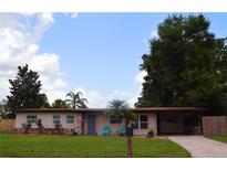 Charming single-story home featuring a well-maintained lawn and inviting curb appeal with mature trees at 5606 Eggleston Ave, Orlando, FL 32810