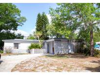 Charming single-story home featuring a unique concrete block design and lush landscaping at 704 Beverly Ave, Altamonte Springs, FL 32701