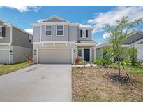 Charming two-story home featuring a two-car garage and inviting curb appeal at 264 Hayley St, Winter Haven, FL 33884