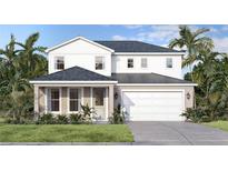 Inviting two-story home featuring a modern white facade, covered entryway, and a two-car garage at 30269 Rustic Mill St, Mount Dora, FL 32757