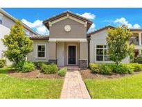 Charming single-Gathering home featuring a well-manicured lawn and inviting entrance at 9544 Mere Pkwy, Orlando, FL 32832