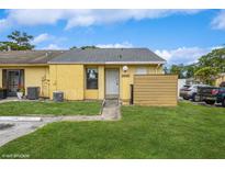 Inviting single-story home with a well-maintained lawn and a charming entrance in a sunny, residential area at 12102 Sandal Creek Way, Orlando, FL 32824