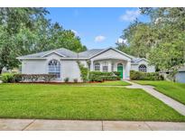 Charming single-story home with a lush green lawn and well-manicured landscaping at 288 Englenook Dr, Debary, FL 32713