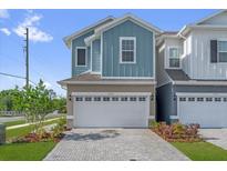 Charming two-story townhome with a large garage and beautiful brick driveway at 1341 Wycliffe Way, St Cloud, FL 34771