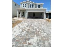 Beautiful two-story home with a spacious two car garage and newly paved driveway at 1908 Diamond Head Cir, Lake Hamilton, FL 33851