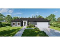 Charming single-story home featuring a modern gray facade, well-maintained lawn and two car garage at 6168 Sw 154Th St, Ocala, FL 34473