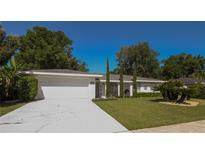 Charming single-story home with a well-manicured front yard and driveway at 1529 Glastonberry Rd, Maitland, FL 32751