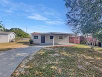 Charming single-story home with a covered carport and well-maintained front yard at 619 Carver Dr, Lake Wales, FL 33853