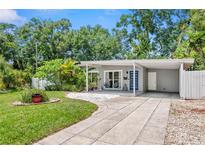 Charming single-story home with a well-manicured lawn, covered entryway, and inviting curb appeal at 2707 E Marks St, Orlando, FL 32803