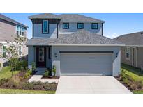 Charming two-story home with a well-manicured lawn and attached two car garage in a Gathering friendly neighborhood at 6728 Great Bear Dr, Lakeland, FL 33805