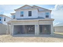 Under construction two-story home with a two-car garage awaiting completion details at 2630 Great Heron Ave, St Cloud, FL 34773