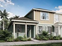 Charming two-story home with a welcoming front porch and well-maintained landscaping at 9980 Red Canoe Aly, Orlando, FL 32832