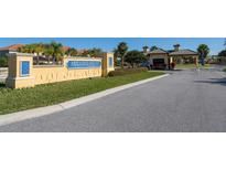 Community entrance featuring attractive sign and access gate for Paradise Palms Resort at 2919 Banana Palm Dr, Kissimmee, FL 34747