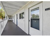 Exterior of condo showing the walkway entrance to unit 214 at 320 Lakeview St # 214, Orlando, FL 32804