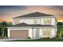 Two-story home featuring a two-car garage, neutral colors, and well-manicured lawn at 6009 Tree Crossing Ln, St Cloud, FL 34771
