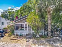 Charming home with mature landscaping and a screened porch at 1314 S Mellonville Ave, Sanford, FL 32771