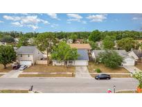 Charming single-story home with mature trees and a well-maintained lawn in a quiet neighborhood at 1993 Excalibur Dr, Orlando, FL 32822